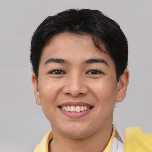 Joyful asian young-adult male with short  brown hair and brown eyes