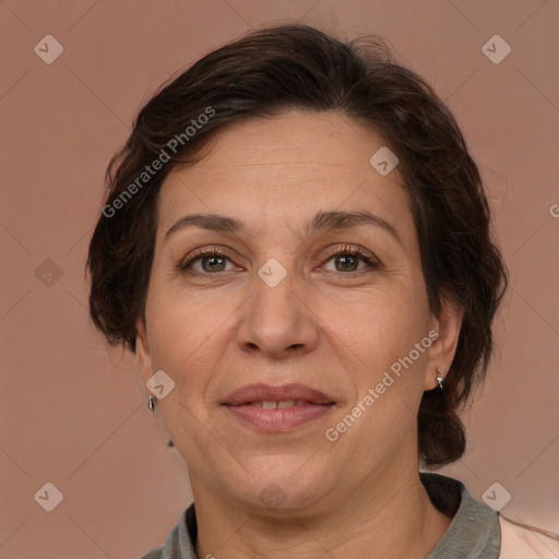 Joyful white adult female with medium  brown hair and grey eyes