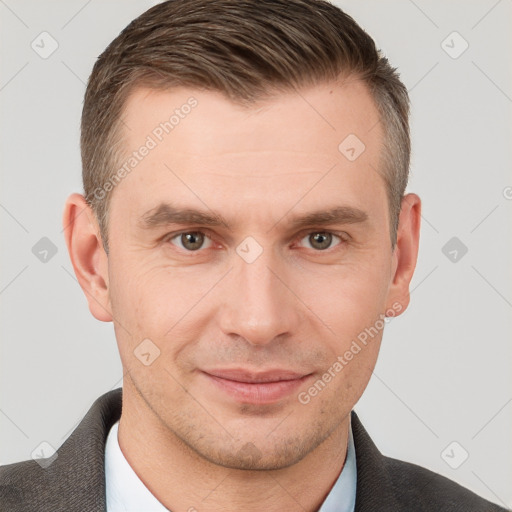 Joyful white young-adult male with short  brown hair and brown eyes