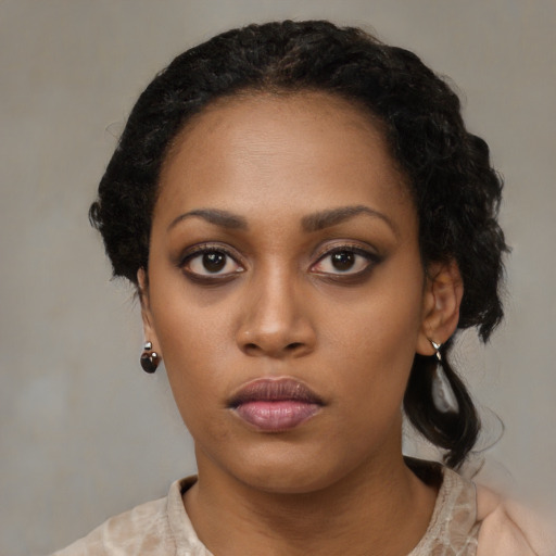 Neutral black young-adult female with medium  black hair and brown eyes