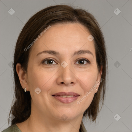 Joyful white adult female with medium  brown hair and brown eyes