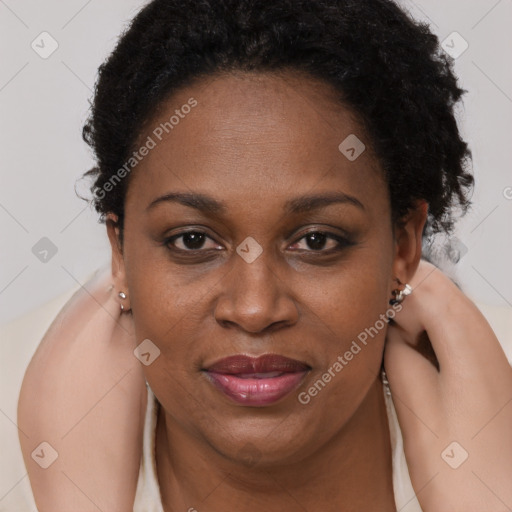 Joyful black young-adult female with short  brown hair and brown eyes