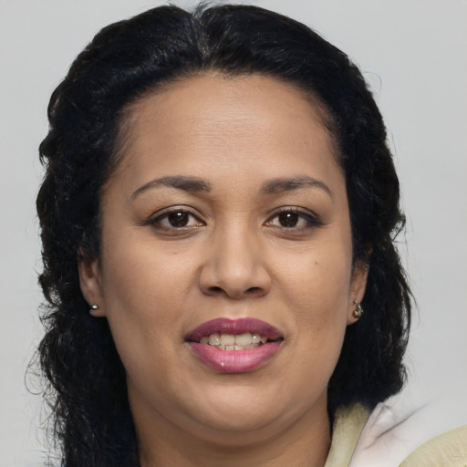 Joyful asian adult female with medium  brown hair and brown eyes