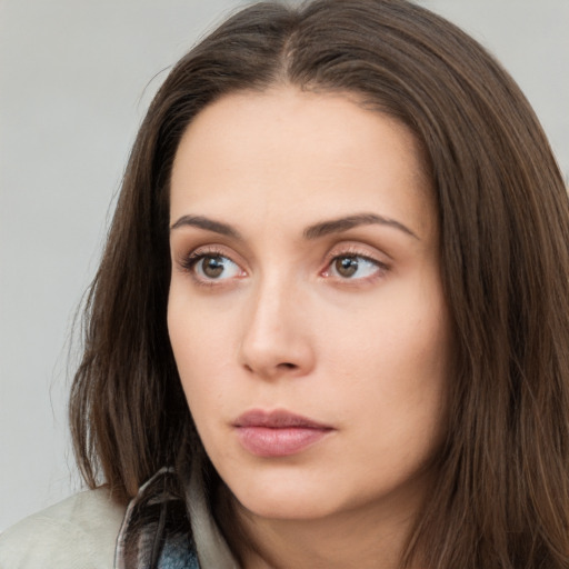 Neutral white young-adult female with long  brown hair and brown eyes