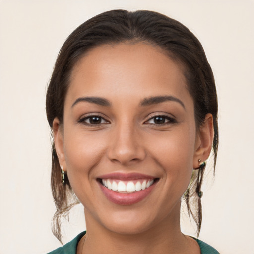 Joyful white young-adult female with medium  brown hair and brown eyes