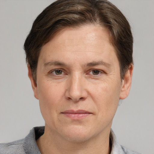 Joyful white adult male with short  brown hair and grey eyes