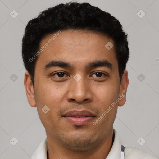 Joyful latino young-adult male with short  black hair and brown eyes