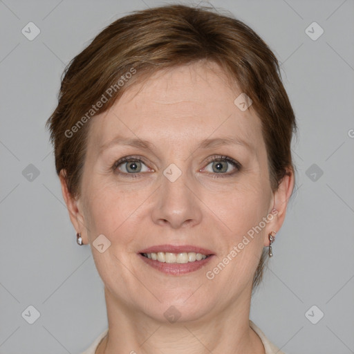 Joyful white adult female with short  brown hair and grey eyes