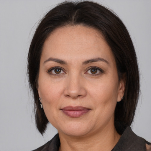 Joyful white adult female with medium  brown hair and brown eyes