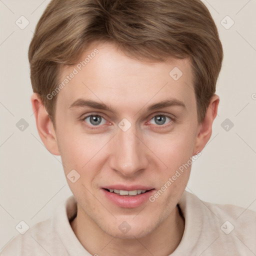 Joyful white young-adult male with short  brown hair and grey eyes