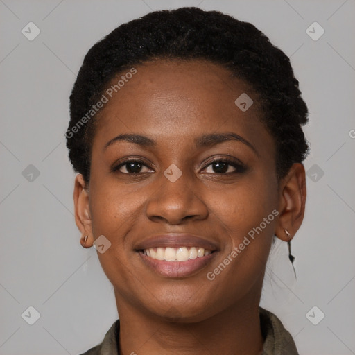 Joyful black young-adult female with short  brown hair and brown eyes