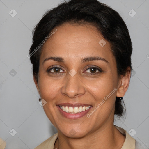 Joyful white adult female with medium  brown hair and brown eyes