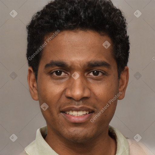 Joyful black young-adult male with short  black hair and brown eyes