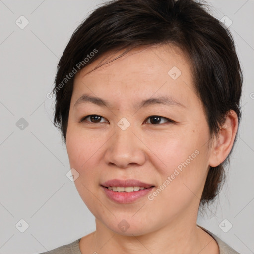 Joyful white young-adult female with medium  brown hair and brown eyes