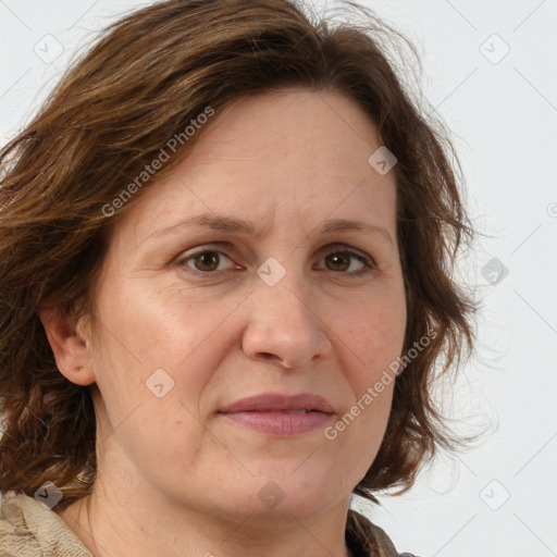 Joyful white adult female with medium  brown hair and green eyes