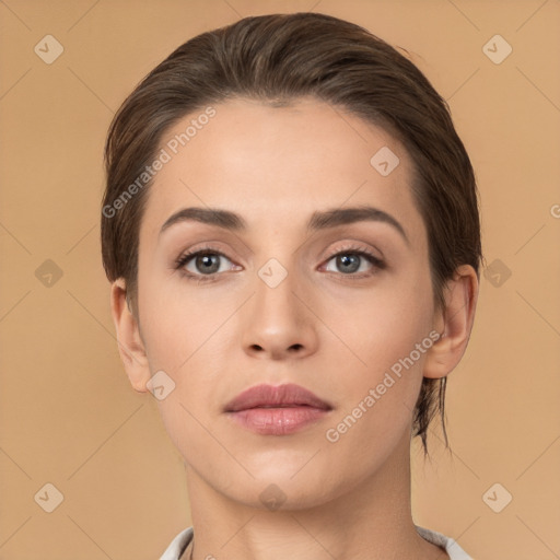 Neutral white young-adult female with medium  brown hair and brown eyes