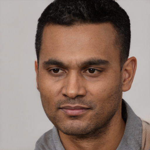 Neutral latino young-adult male with short  black hair and brown eyes