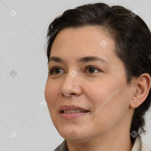 Joyful white adult female with short  brown hair and brown eyes