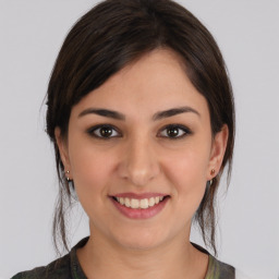 Joyful white young-adult female with medium  brown hair and brown eyes