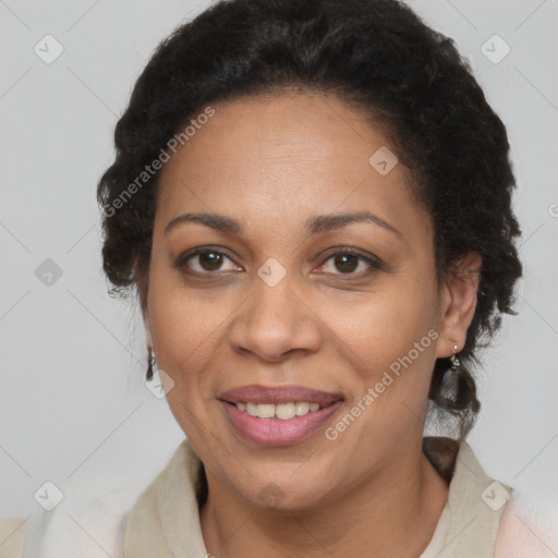 Joyful black adult female with short  brown hair and brown eyes