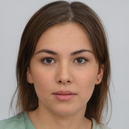 Neutral white young-adult female with medium  brown hair and brown eyes