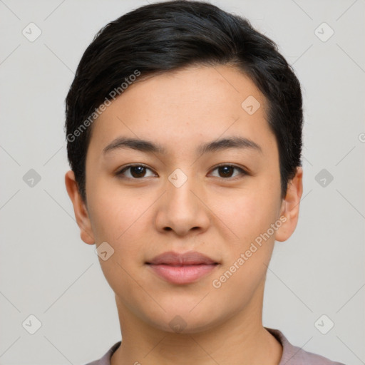 Joyful latino young-adult female with short  black hair and brown eyes