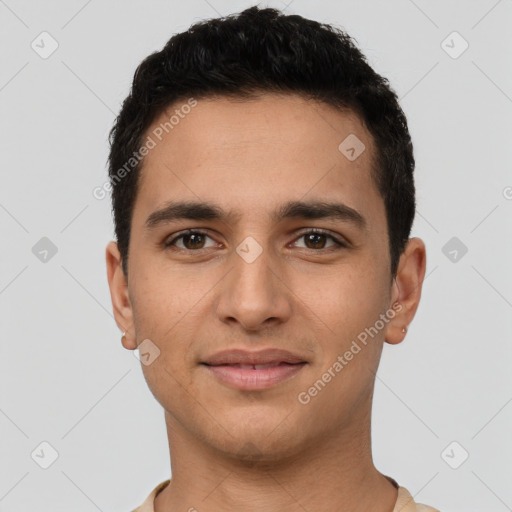 Joyful latino young-adult male with short  brown hair and brown eyes