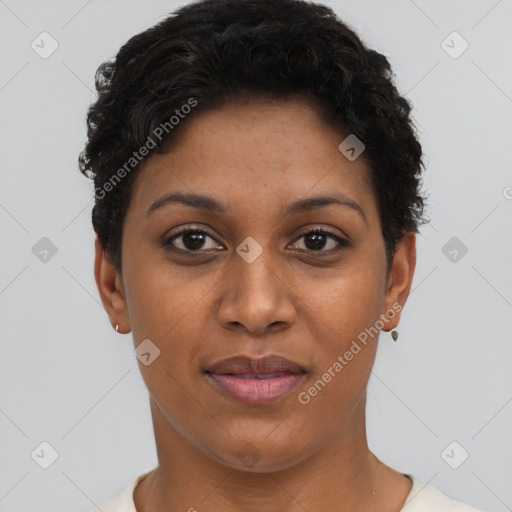 Joyful black young-adult female with short  black hair and brown eyes