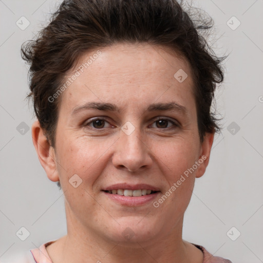 Joyful white adult female with short  brown hair and brown eyes