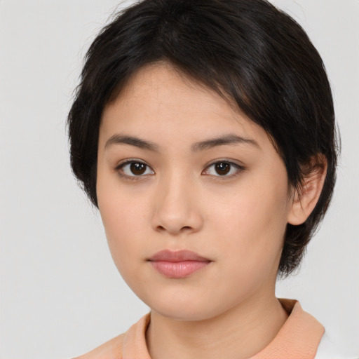 Neutral asian young-adult female with medium  brown hair and brown eyes