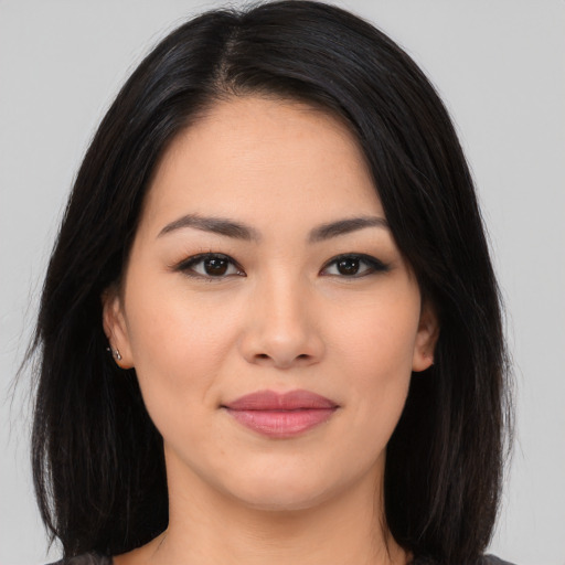 Joyful white young-adult female with long  black hair and brown eyes