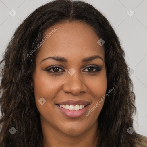 Joyful black young-adult female with long  brown hair and brown eyes