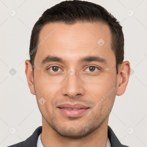 Joyful white young-adult male with short  brown hair and brown eyes