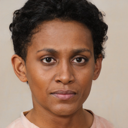 Neutral black young-adult female with short  brown hair and brown eyes