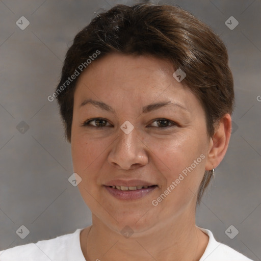 Joyful white adult female with short  brown hair and brown eyes