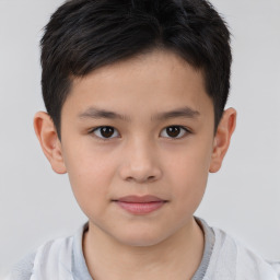 Joyful white child male with short  brown hair and brown eyes