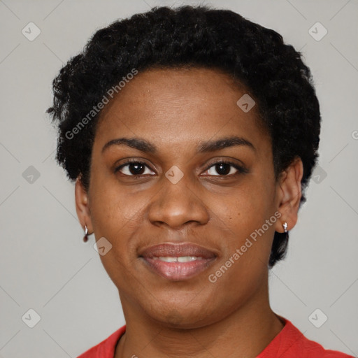 Joyful black young-adult female with short  black hair and brown eyes
