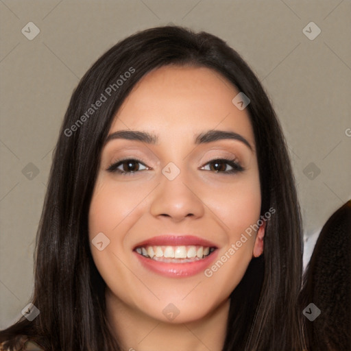 Joyful white young-adult female with long  black hair and brown eyes