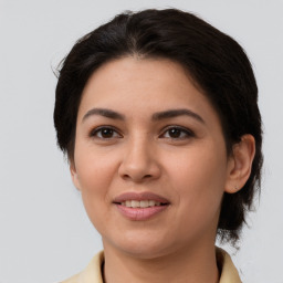 Joyful white young-adult female with medium  brown hair and brown eyes