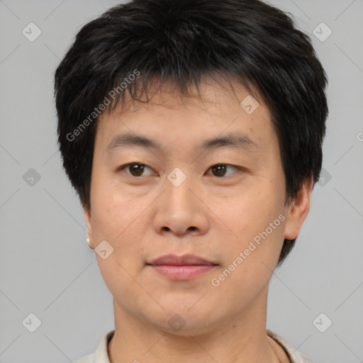 Joyful asian young-adult male with short  brown hair and brown eyes