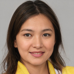 Joyful white young-adult female with medium  brown hair and brown eyes