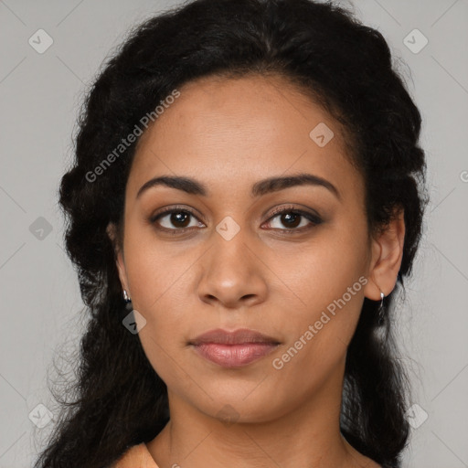 Joyful latino young-adult female with long  black hair and brown eyes