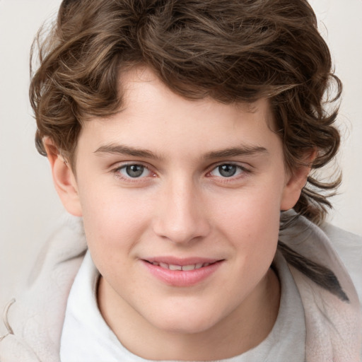 Joyful white child male with medium  brown hair and brown eyes