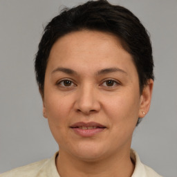 Joyful white adult female with short  brown hair and brown eyes