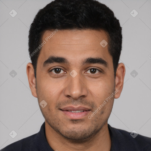 Joyful latino young-adult male with short  black hair and brown eyes