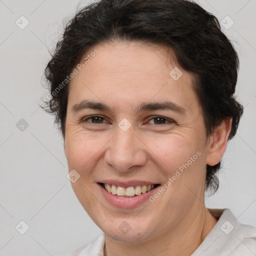 Joyful white adult female with short  brown hair and brown eyes