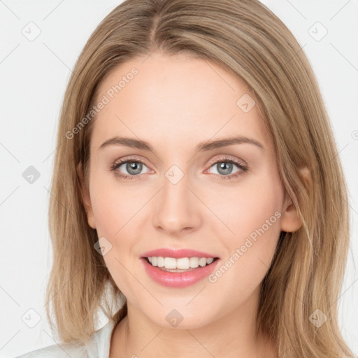 Joyful white young-adult female with long  brown hair and blue eyes