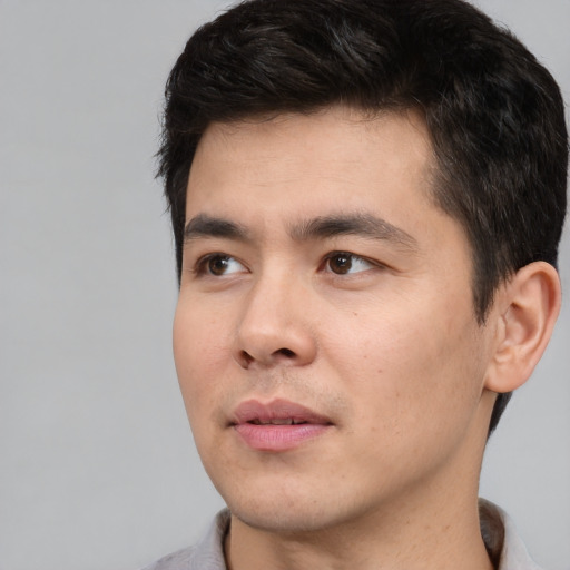 Neutral white young-adult male with short  black hair and brown eyes