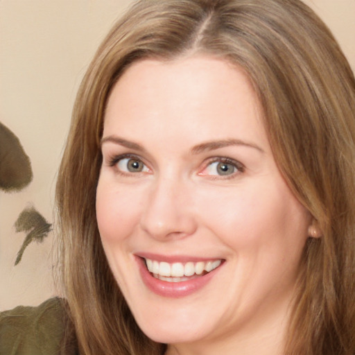 Joyful white adult female with long  brown hair and brown eyes