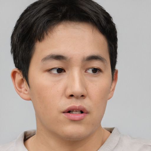 Neutral asian young-adult male with short  brown hair and brown eyes